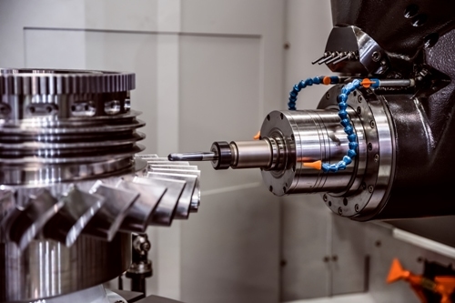 644383741 CNC milling machine cutting a metal turbine fan