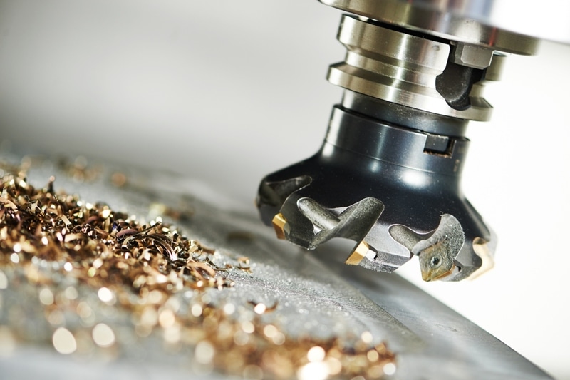 419731342 Close up of a milling cutter with metal shavings