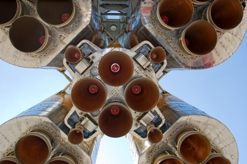 57929056 Looking upwards at a space rocket from the view of the platform